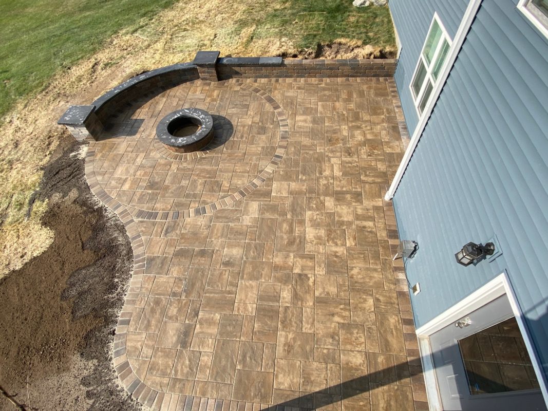 Brick patio and fire pit under construction